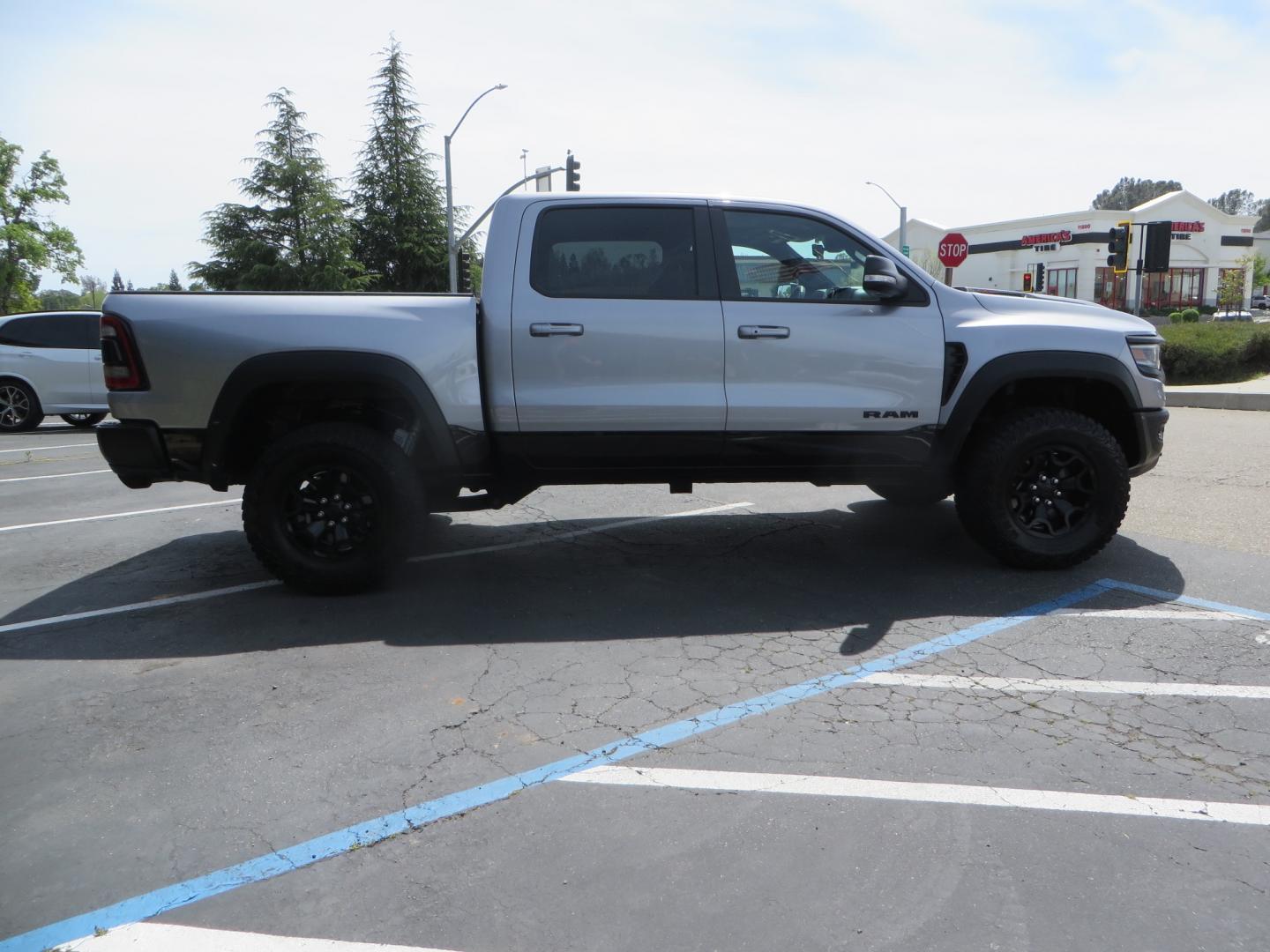 2021 SILVER /BLACK RAM 1500 TRX Crew Cab SB 4WD (1C6SRFU90MN) with an 6.2L V8 OHV 16V engine, 8A transmission, located at 2630 Grass Valley Highway, Auburn, CA, 95603, (530) 508-5100, 38.937893, -121.095482 - Photo#3